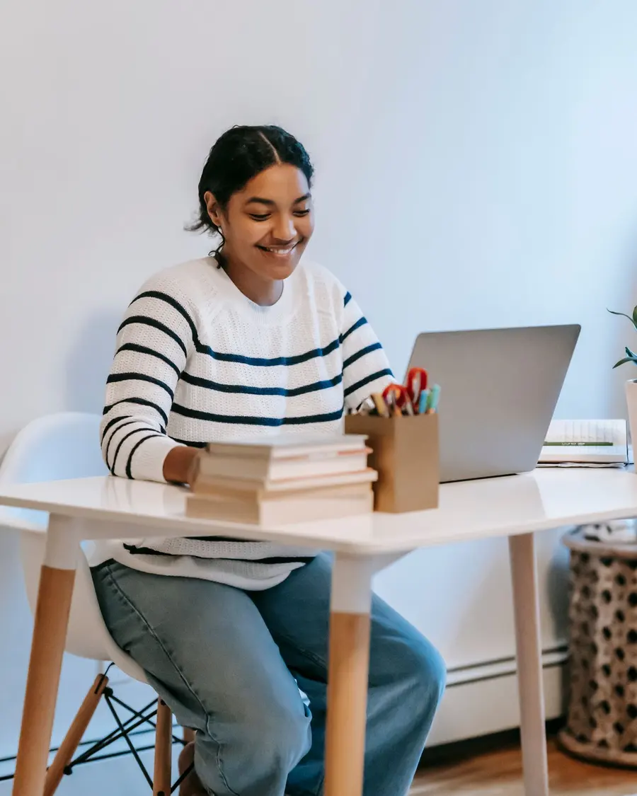 Smiling professional on a video consult at her laptop
